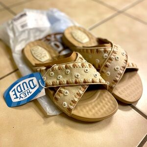New with tags, size 9, Hey Dude women’s slip on sandal. Super comfy, super cute.